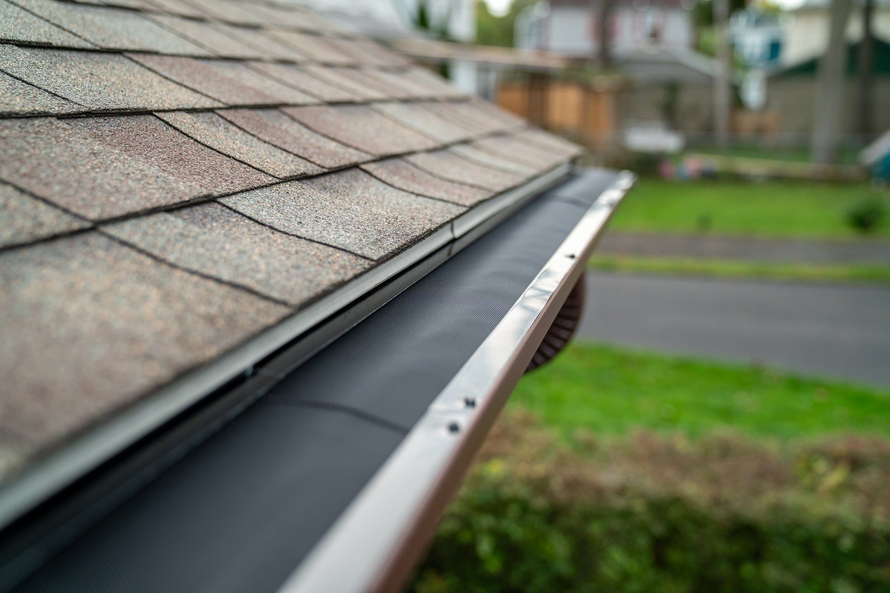 BroGuard stainless micro-mesh gutter guard installed along a roof edge