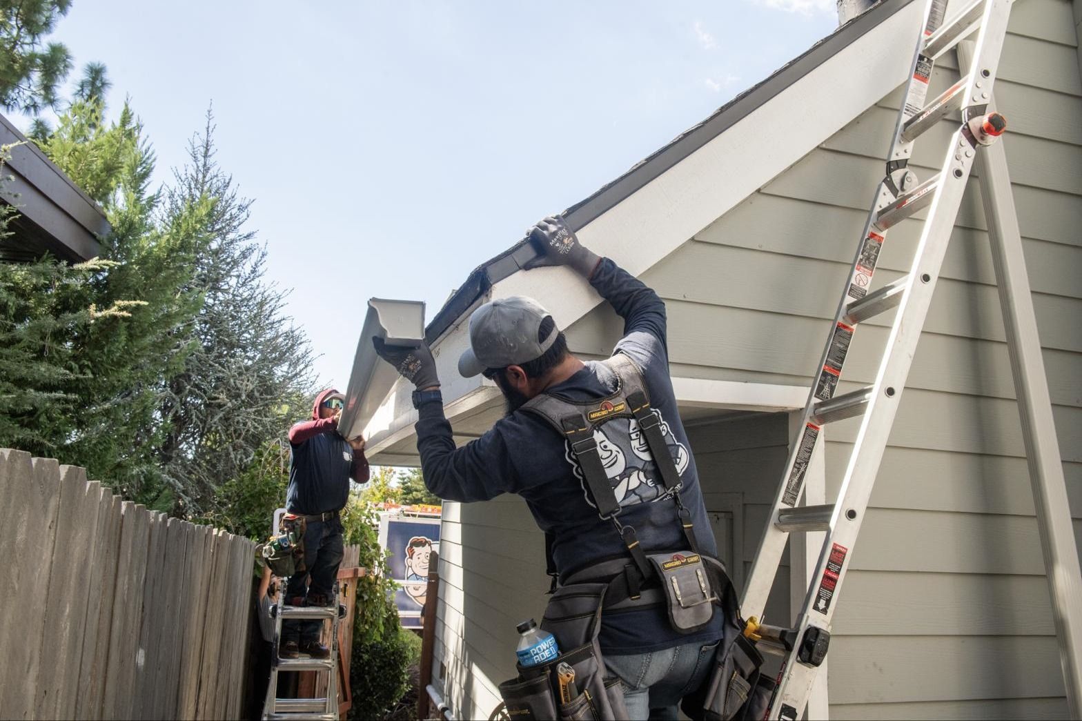 The Irvine crew hanging a new seamless gutter run