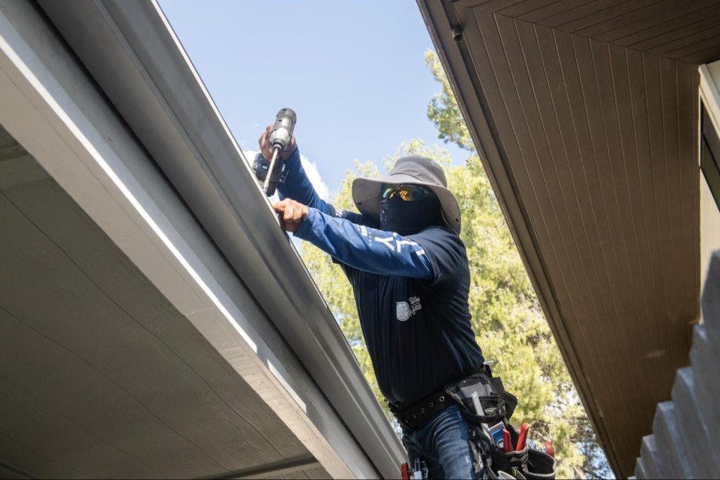 Drilling hidden hangers into a new seamless gutter run