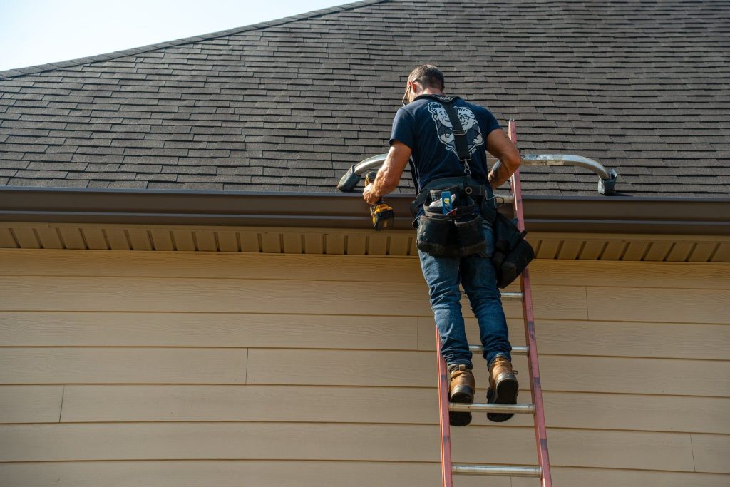 Installer working at the roof edge